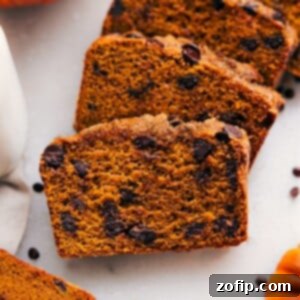 Moist and flavorful healthy pumpkin bread slices, packed with nutritious ingredients and fall spices.