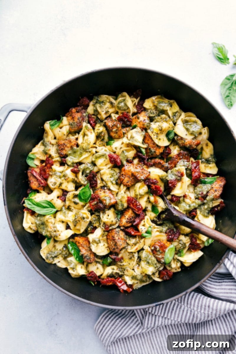 Overhead shot of Pesto Chicken Tortellini, still in the pot, ready to be served.