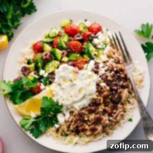 Easy Greek Ground Turkey Meal Prep 2 A vibrant Greek Turkey Bowl featuring seasoned ground turkey, lemon-parsley rice, fresh vegetables, and tzatziki sauce.