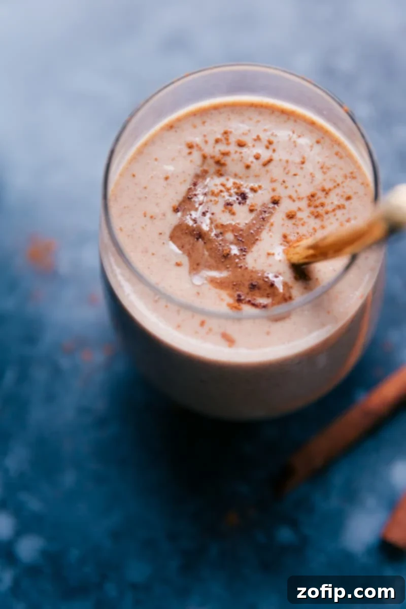 Up-close image of a single Cauliflower Smoothie in a clear glass, showing its smooth, thick texture and light brown color.