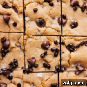 Chocolate Chip Cookie Bars cut into squares, showcasing their soft interior and melted chocolate.