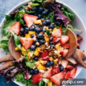 A vibrant bowl of Mango Salad with fresh fruit and creamy dressing, perfect for a healthy meal.