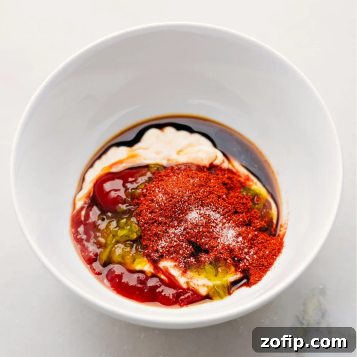 How To Make Fry Sauce All the fry sauce ingredients, including ketchup, mayo, relish, paprika, and Worcestershire sauce, combined in a bowl and ready to be mixed.