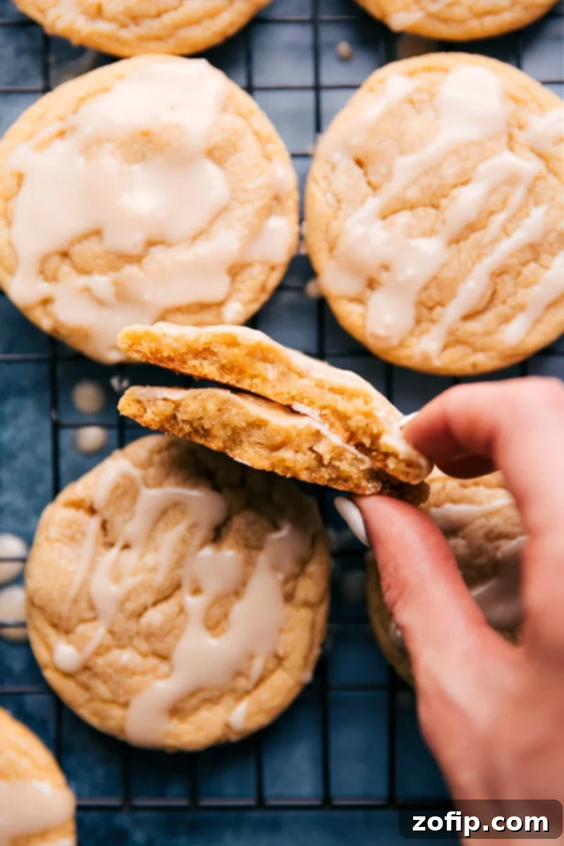 Irresistible Maple Cookies That Taste Like A Maple Donut Delicious maple cookies with a sweet maple glaze, cooling on a rack, ready to be enjoyed.