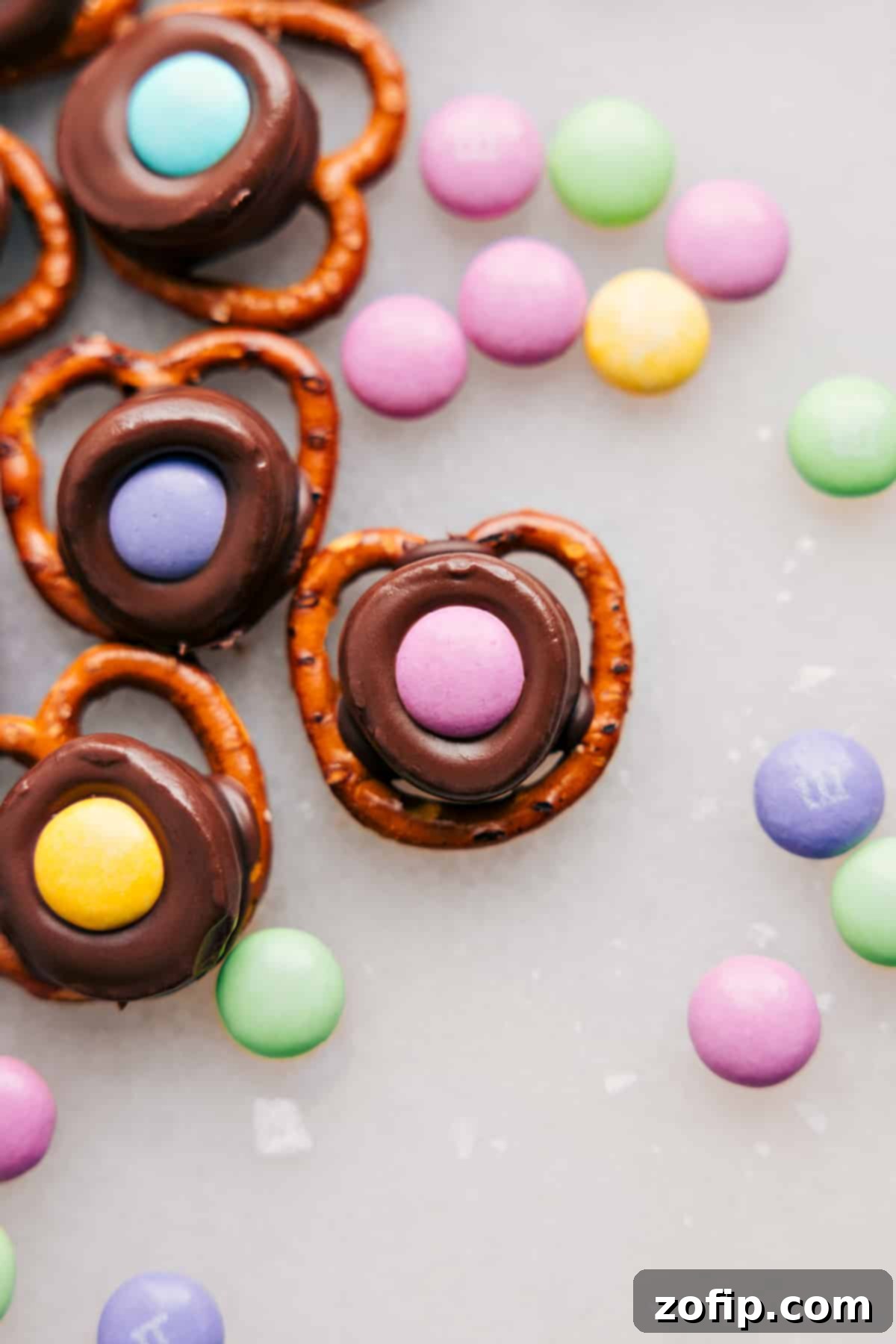 A close-up of a finished Easter Pretzel, highlighting the perfect combination of chocolate, pretzel, and M&M.