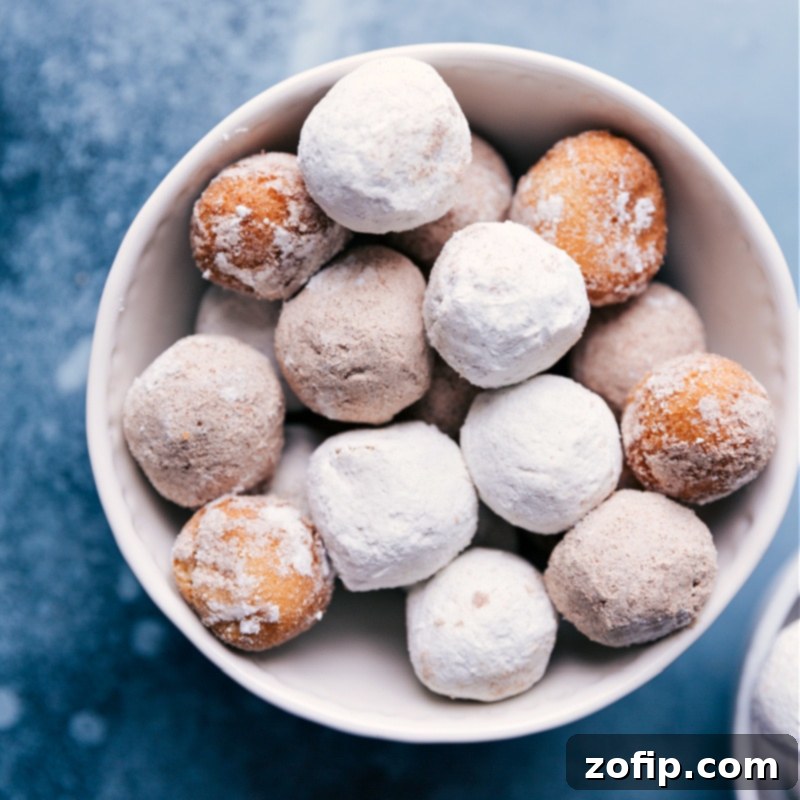 A large, rustic ceramic bowl overflowing with an abundant collection of assorted donut holes, including glazed, powdered, and chocolate varieties, suggesting a plentiful and delicious supply perfect for filling Easter treat bags.