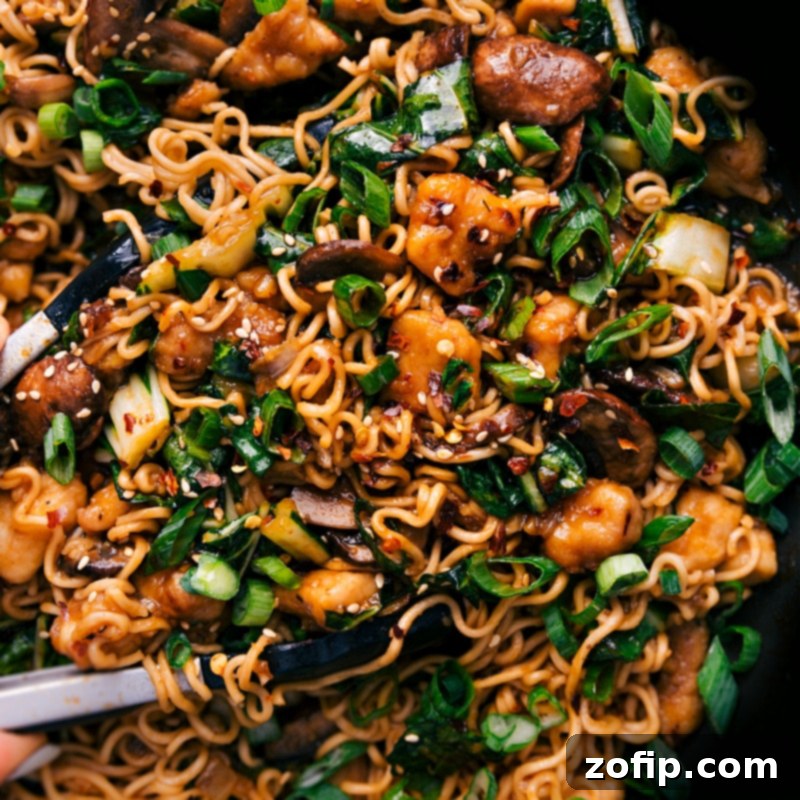 Up close overhead image of the General Tso Ramen, showcasing the vibrant ingredients and glossy sauce