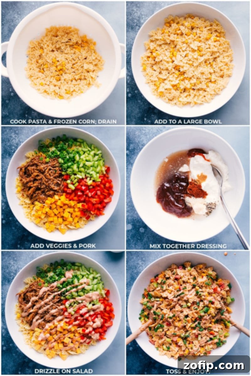 A vibrant BBQ pasta salad tossed with creamy dressing, pulled pork, cheese, and vegetables in a large serving bowl, perfect for a gathering.