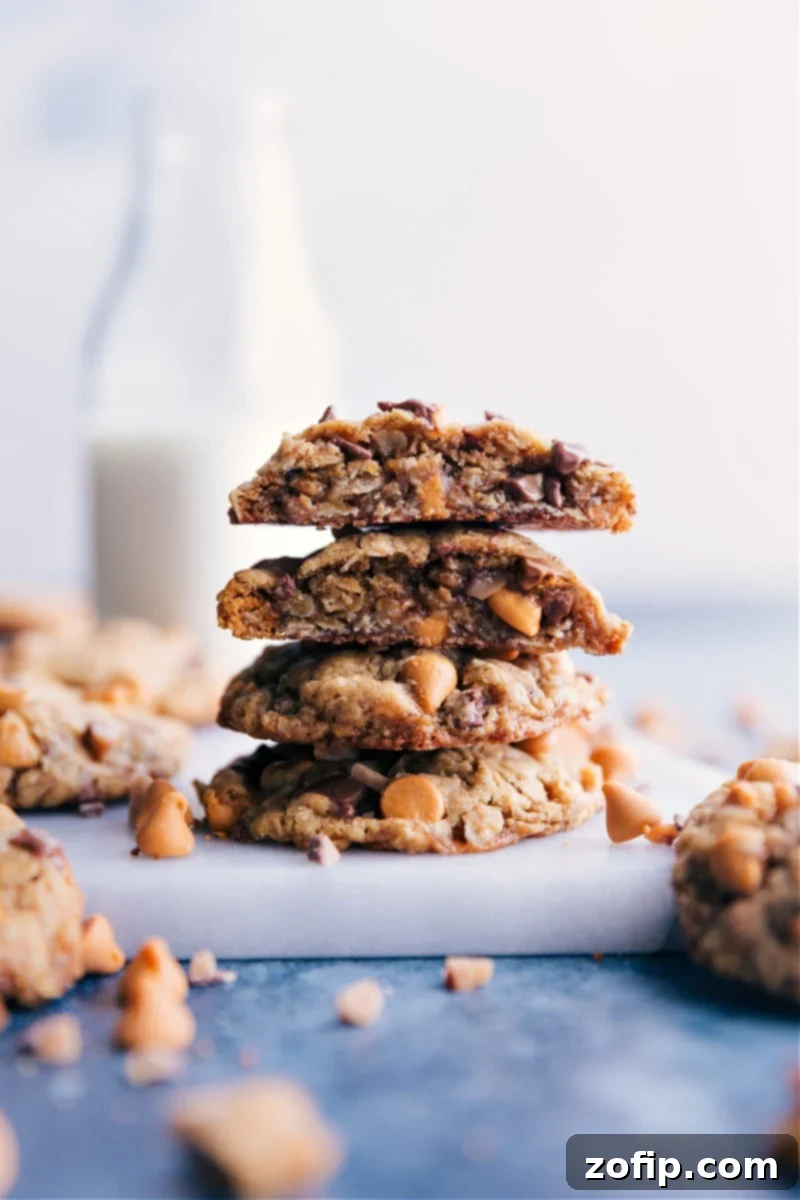 A beautifully arranged stack of golden-brown Oatmeal Scotchies, revealing their thick, chewy texture, studded with butterscotch chips and oats, ready to be enjoyed.