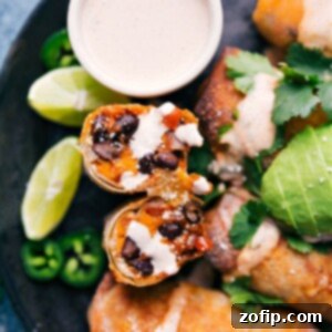 Crispy Air Fried Sweet Potato Black Bean Egg Rolls 2 Close-up of a perfectly golden-brown Air Fryer Sweet Potato and Black Bean Egg Roll, showing its crispy texture and delicious filling.