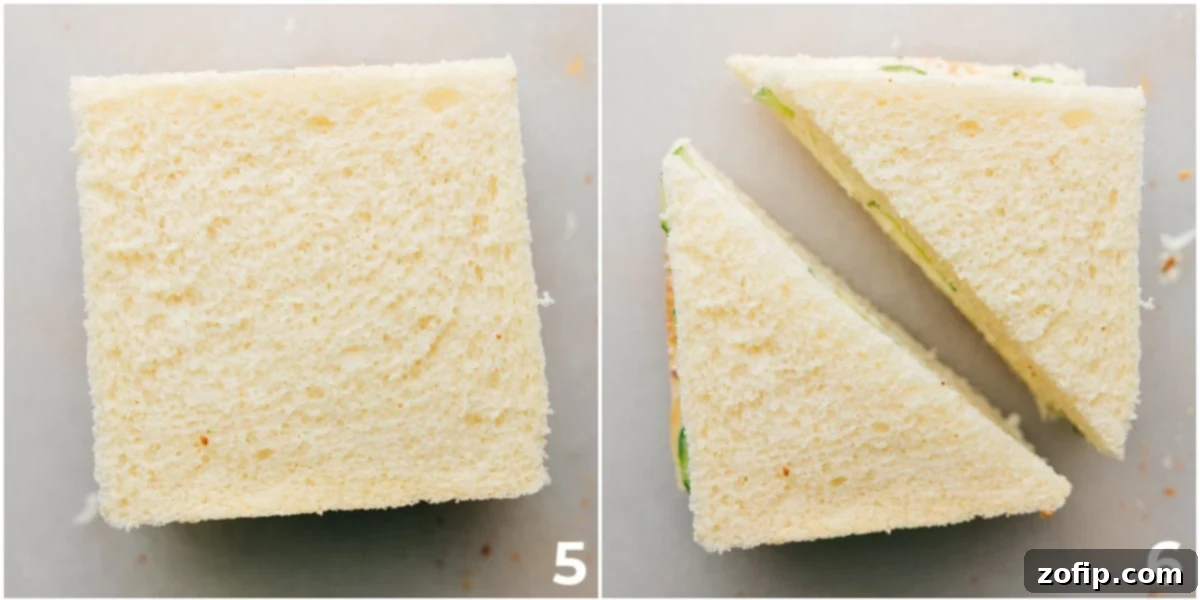 The crust being cut off a cucumber sandwich, and another sandwich being cut in half, preparing for serving.
