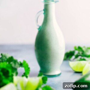 A small jar of homemade Cafe Rio Salad Dressing, creamy and green, ready for use.