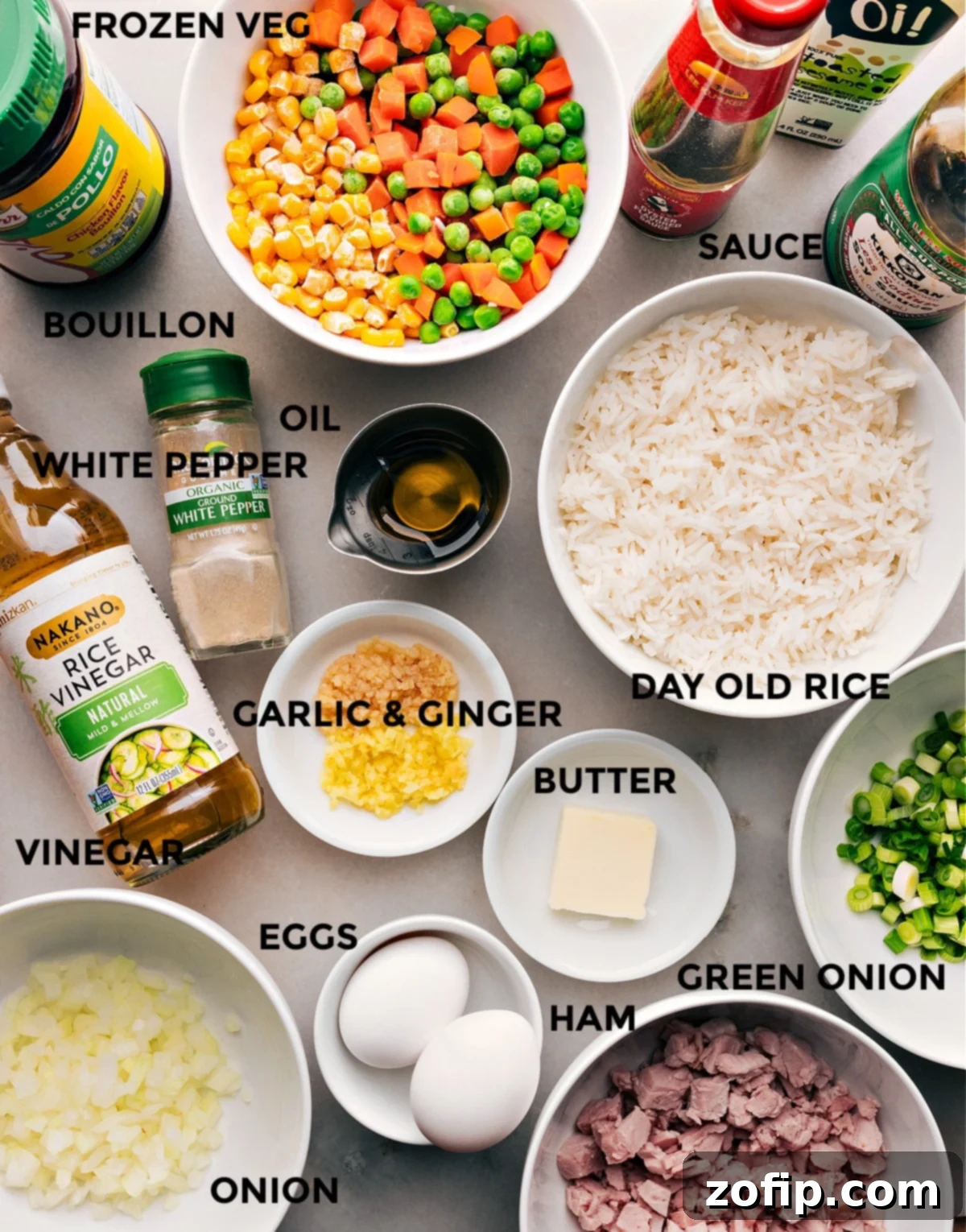 Ingredients used in this dish prepped out ready to be used. Close-up of diced ham, vegetables, and sauces.