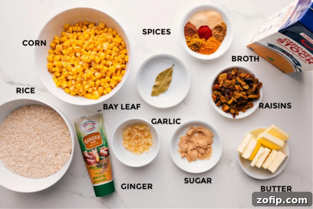 All the ingredients in this recipe prepped out for easy assembly including the rice, corn, ginger, bay leaf, garlic, sugar, butter, raisins, broth, and spices.