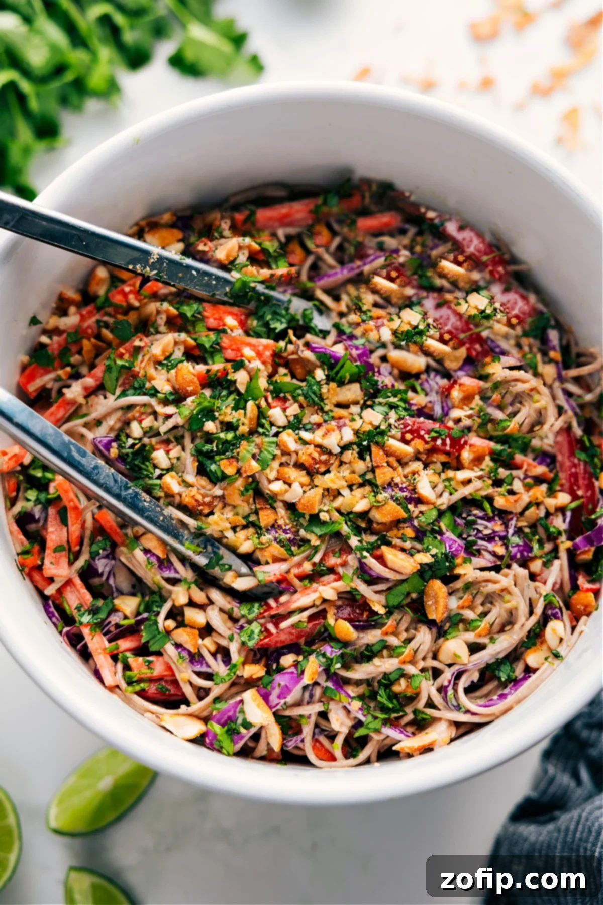 Soba Noodle Salad Recipe in a bowl tossed together and topped with extra peanuts.