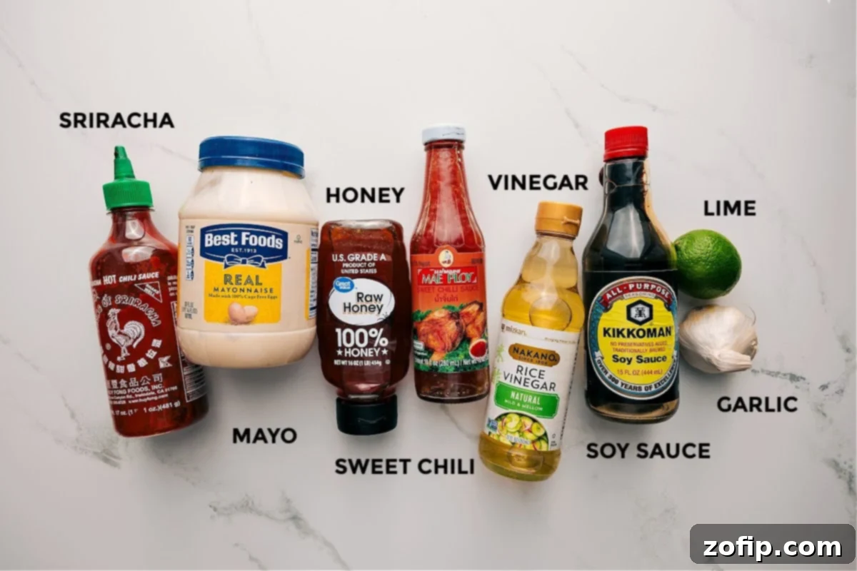 All the dressing ingredients for this soba noodle salad recipe prepped out for easy assembly including the sriracha, mayo, honey, sweet chili, vinegar, soy sauce, garlic, and lime.