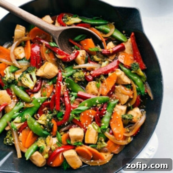 Cashew Chicken Delight 2 Chicken stir fry in a skillet, brimming with vegetables and rich flavors, prepared for serving.